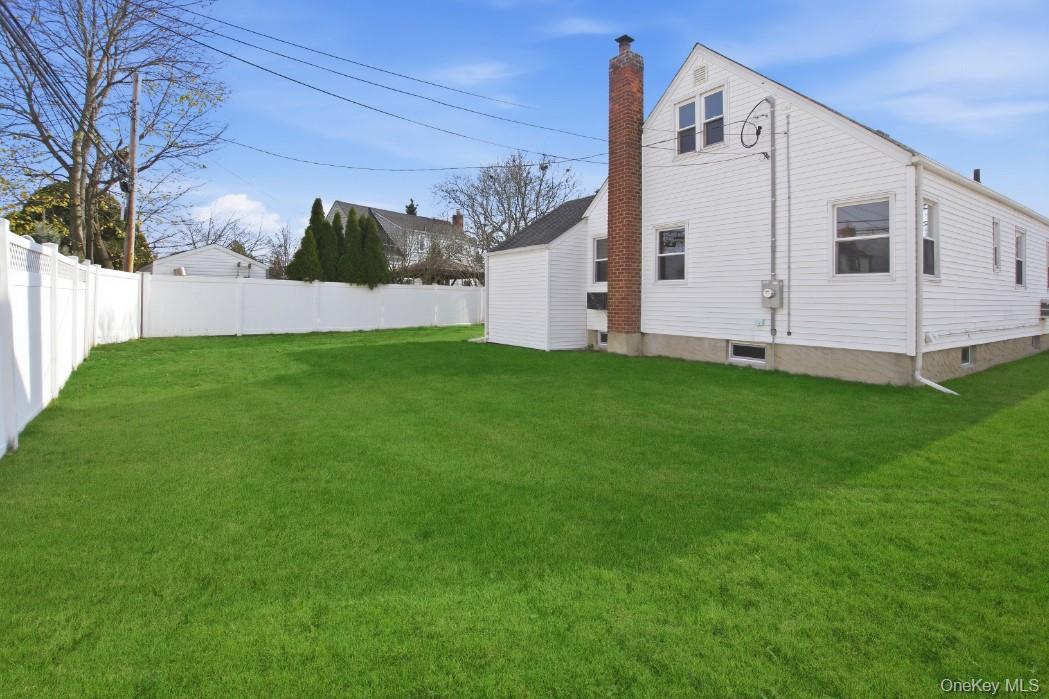 57 Remson Street Valley Stream, NY 11580 - Photo 3 of 27 Rear view of house and private back yard