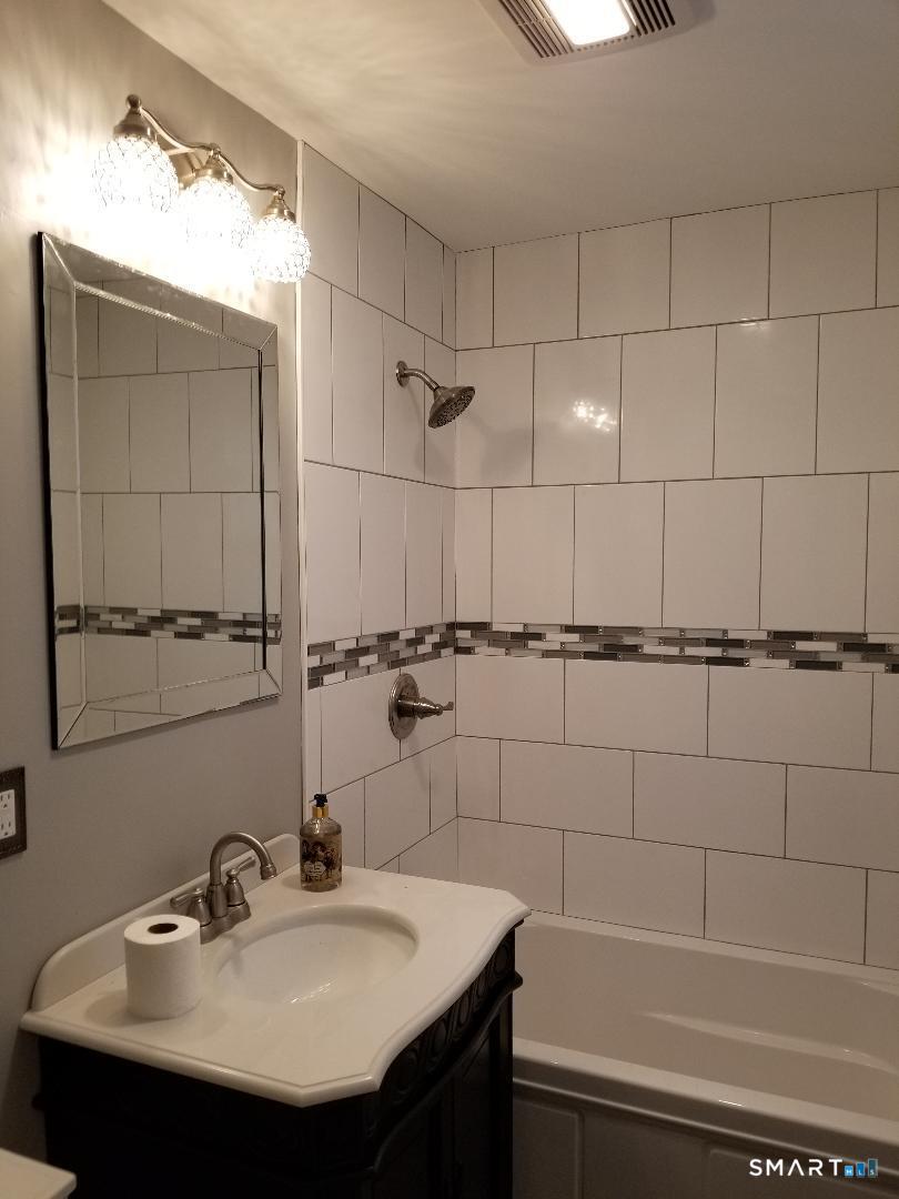 103 Windsor Street Enfield, CT 06082 - Photo 12 of 22 a bathroom with a sink and a bathtub