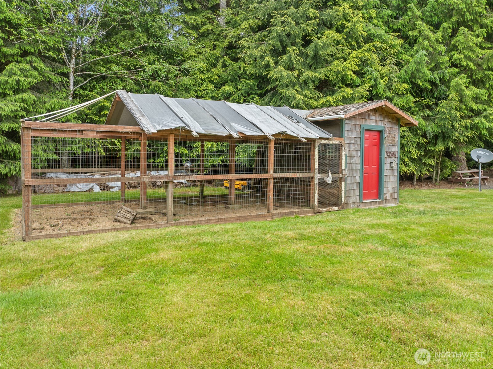 132 River Park Road Forks, WA 98331 - Photo 35 of 40 a backyard of a house with table and chairs
