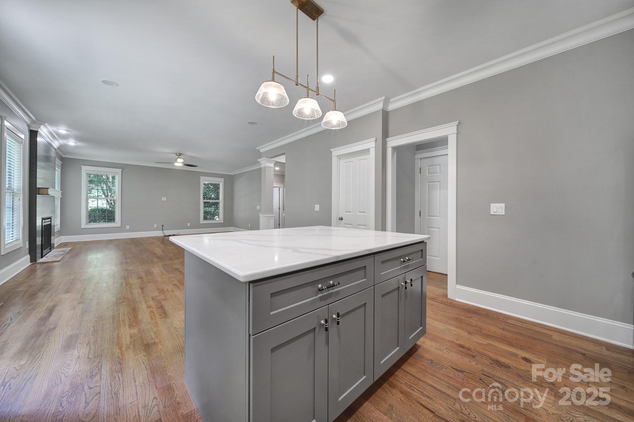 5633 Open Book Lane Charlotte, NC 28270 - Photo 17 of 48 a kitchen with a stove and wooden floor