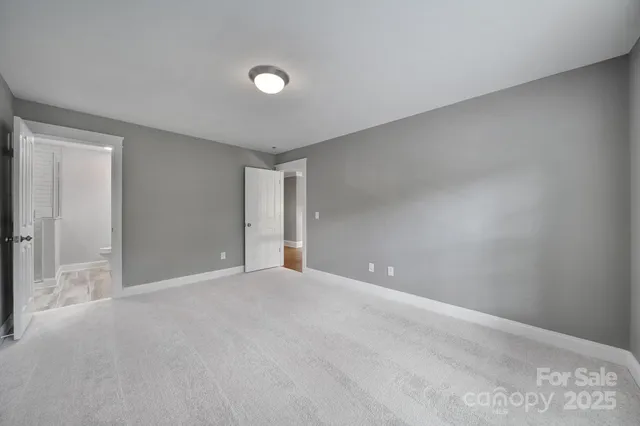 a bathroom with a sink shower and a mirror