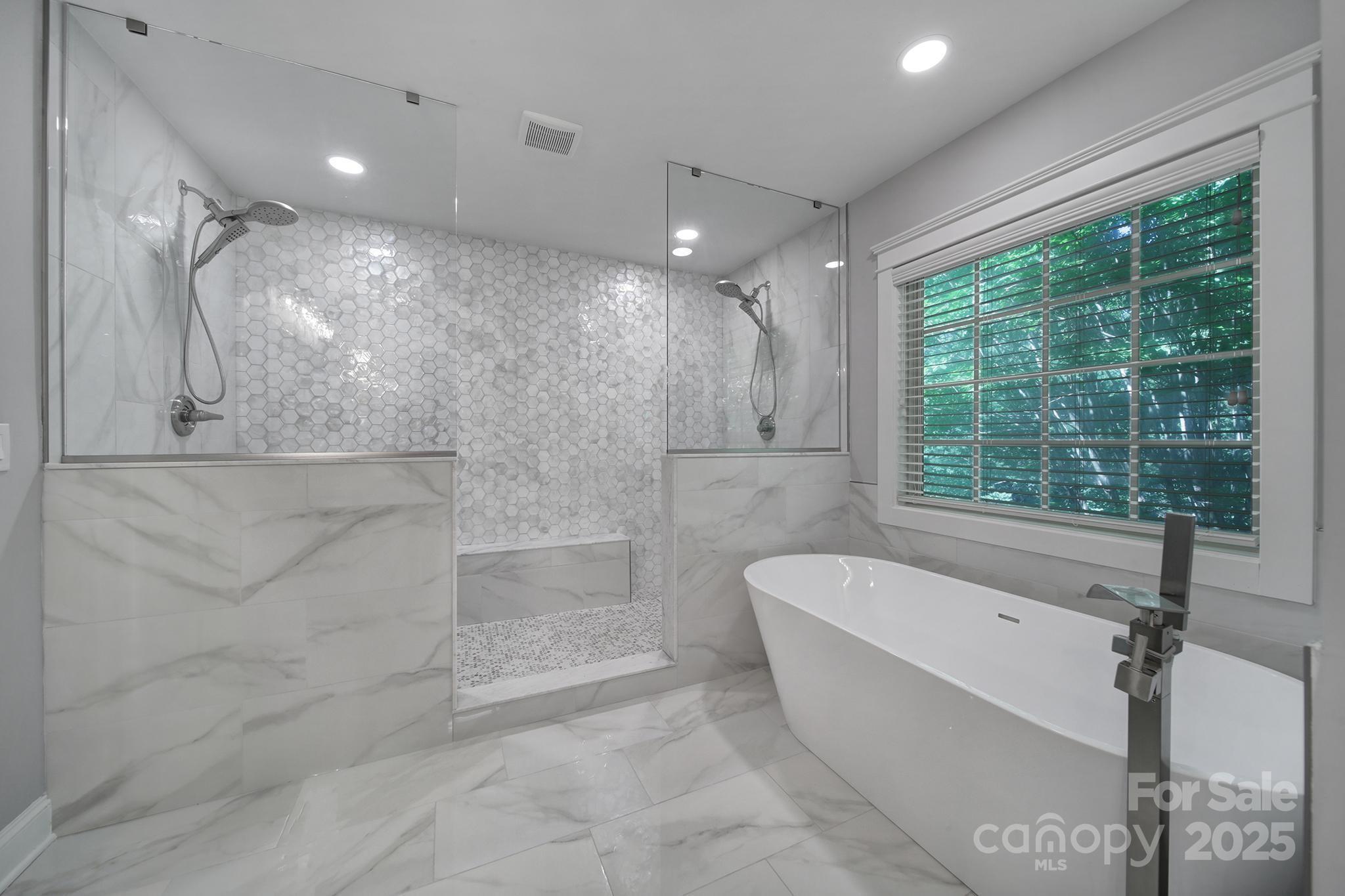 5633 Open Book Lane Charlotte, NC 28270 - Photo 37 of 48 a bathroom with a large tub a shower and view