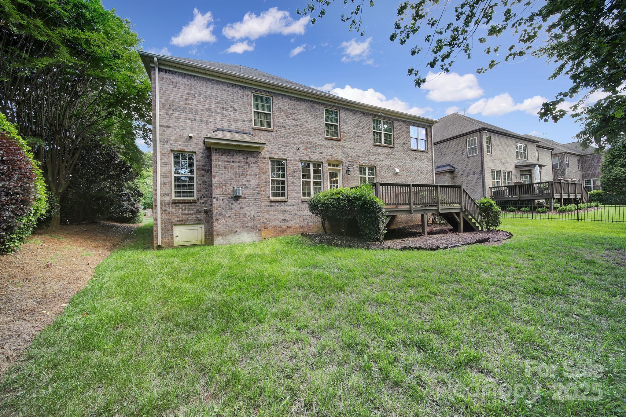 5633 Open Book Lane Charlotte, NC 28270 - Photo 46 of 48 a front view of a house with a yard