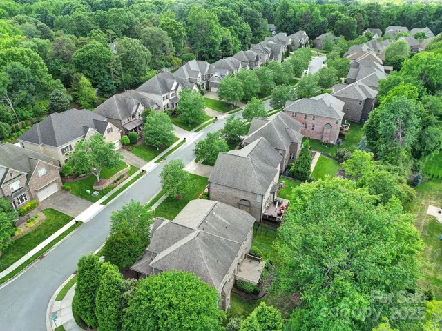an aerial view of house with yard