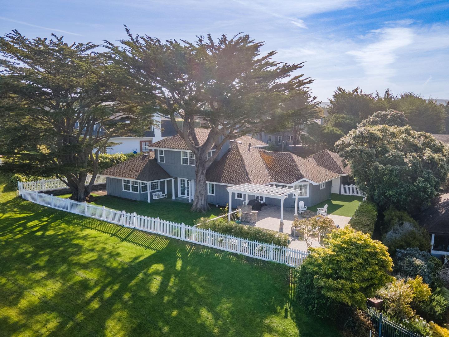 351 Cypress Point Road Half Moon Bay, CA 94019 - Photo 11 of 39 a view of a house with a big yard and large tree