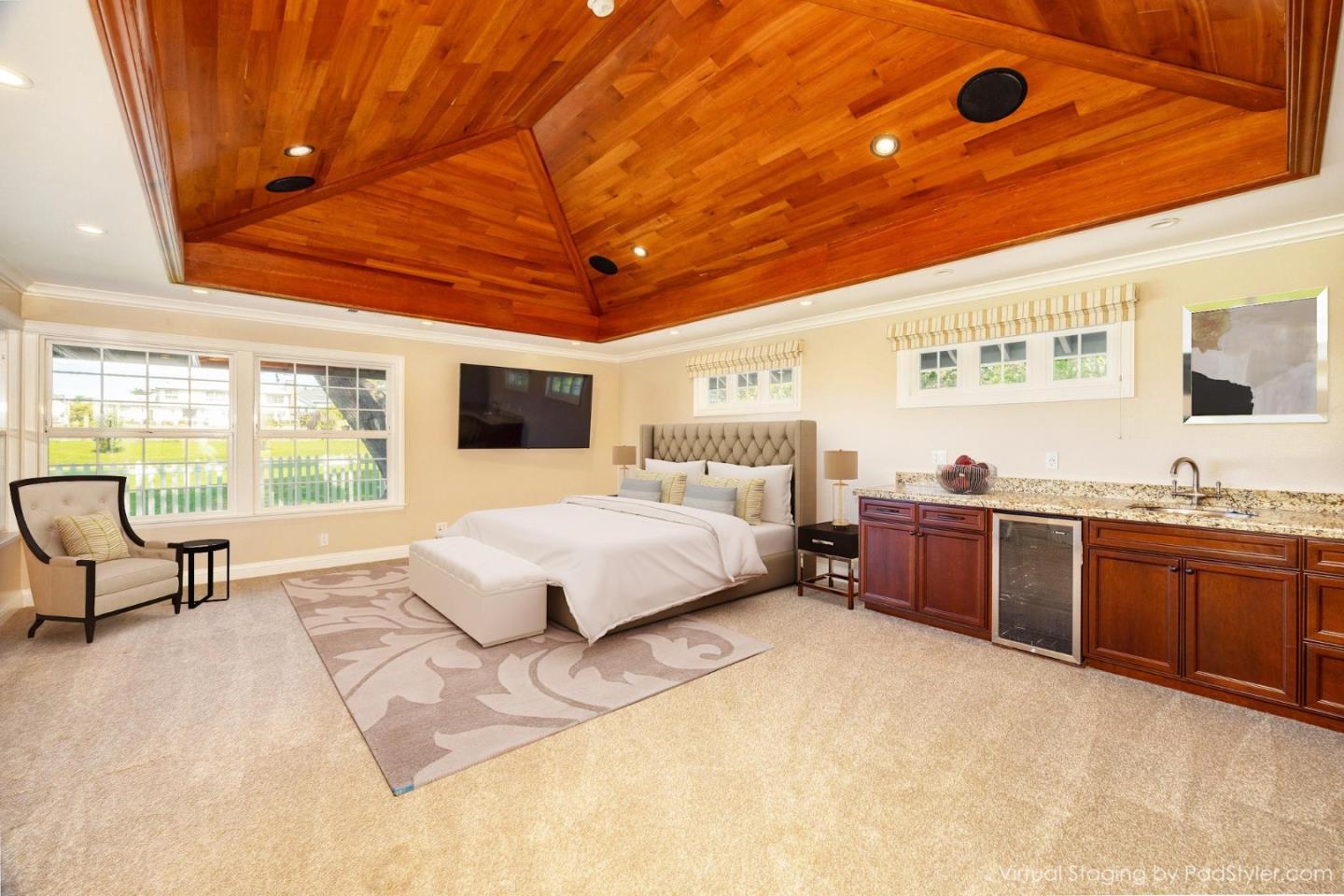 351 Cypress Point Road Half Moon Bay, CA 94019 - Photo 15 of 39 a spacious bedroom with a large bed and a chandelier