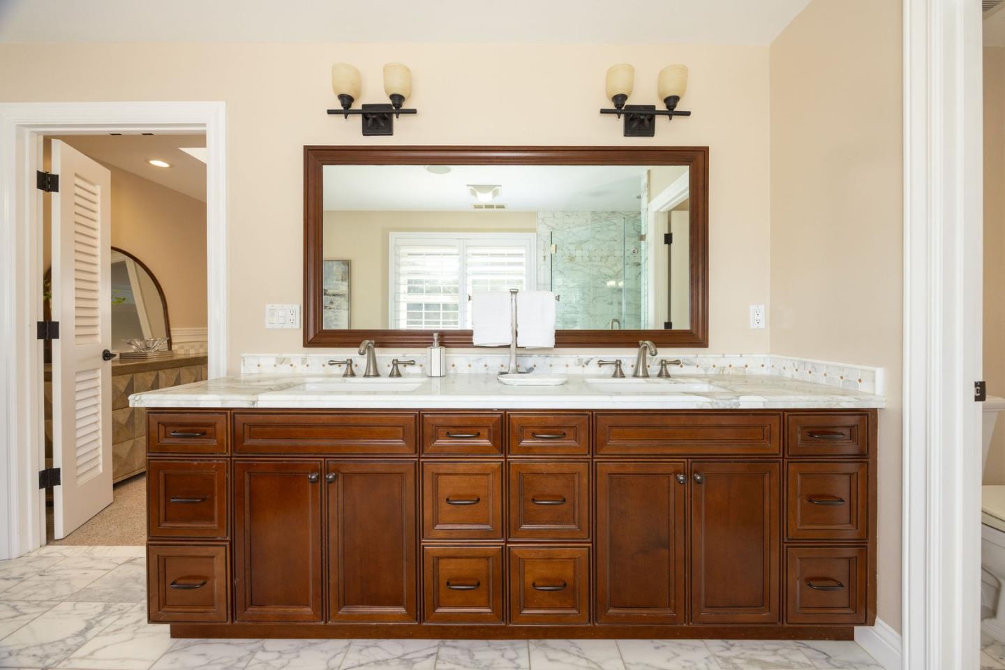 351 Cypress Point Road Half Moon Bay, CA 94019 - Photo 25 of 39 a bathroom with a granite countertop sink and a mirror