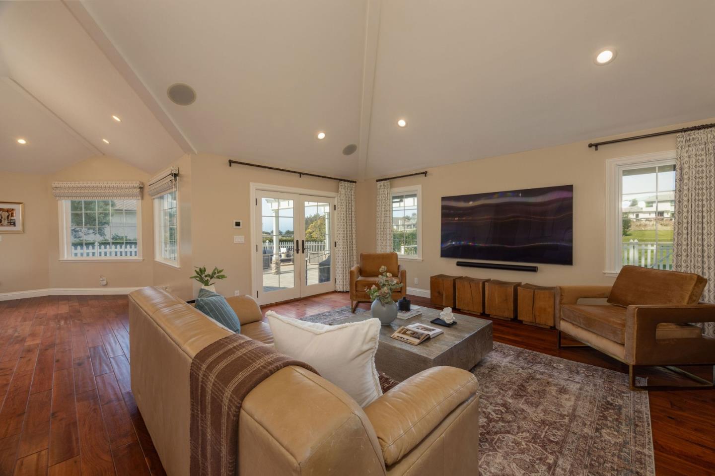 351 Cypress Point Road Half Moon Bay, CA 94019 - Photo 8 of 39 a living room with furniture and a flat screen tv