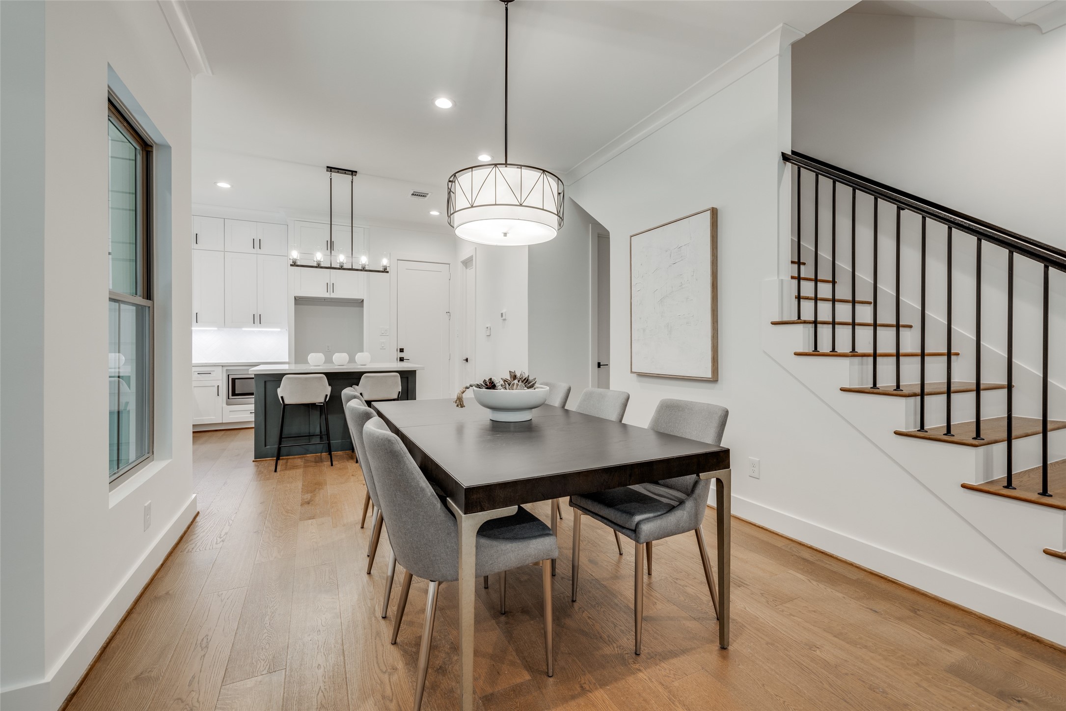 2325 Richton Street Houston, TX 77098 - Photo 19 of 47 a view of a a dining room and hall with wooden floor