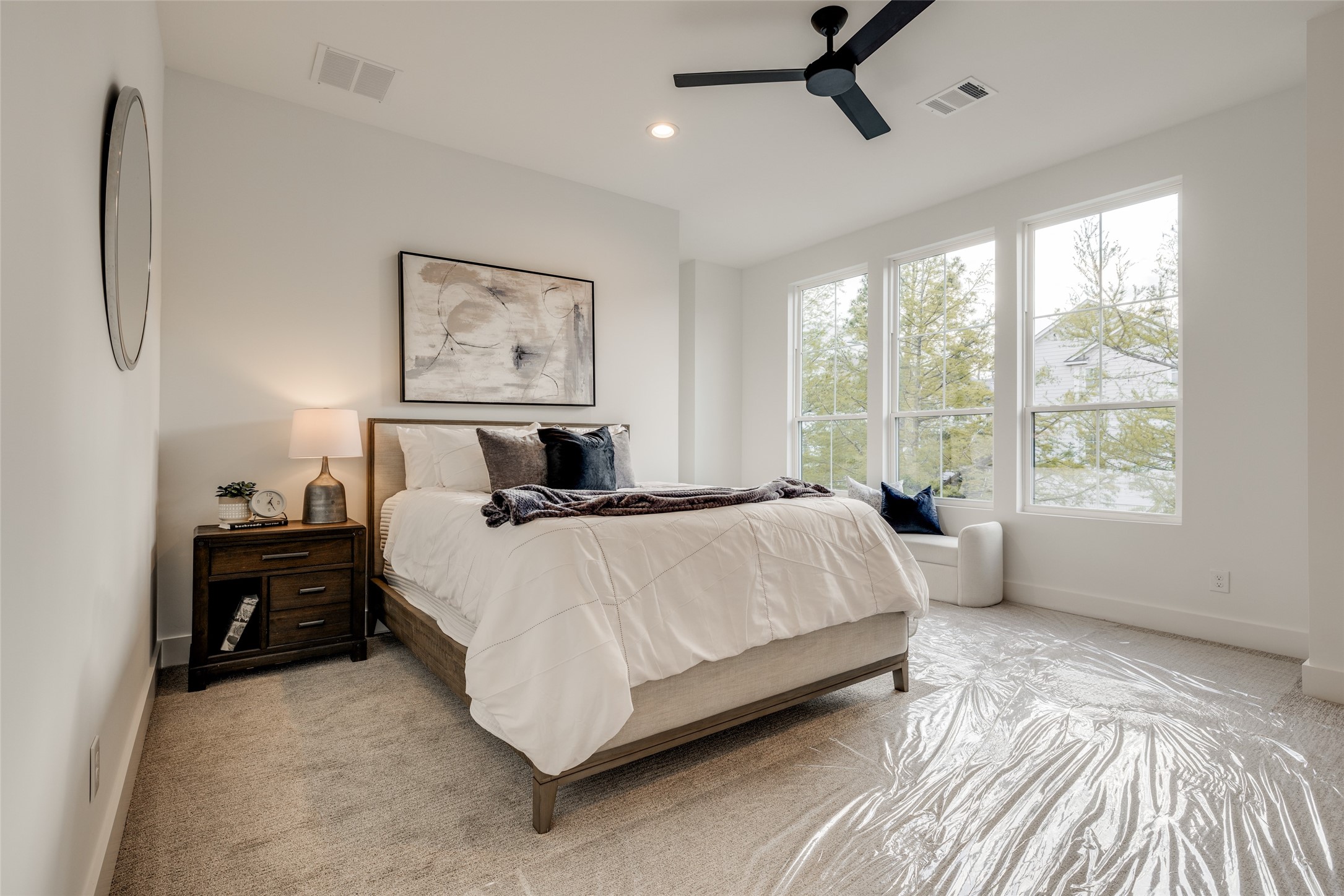 2325 Richton Street Houston, TX 77098 - Photo 34 of 47 a bedroom with a bed painting on wall and a large window