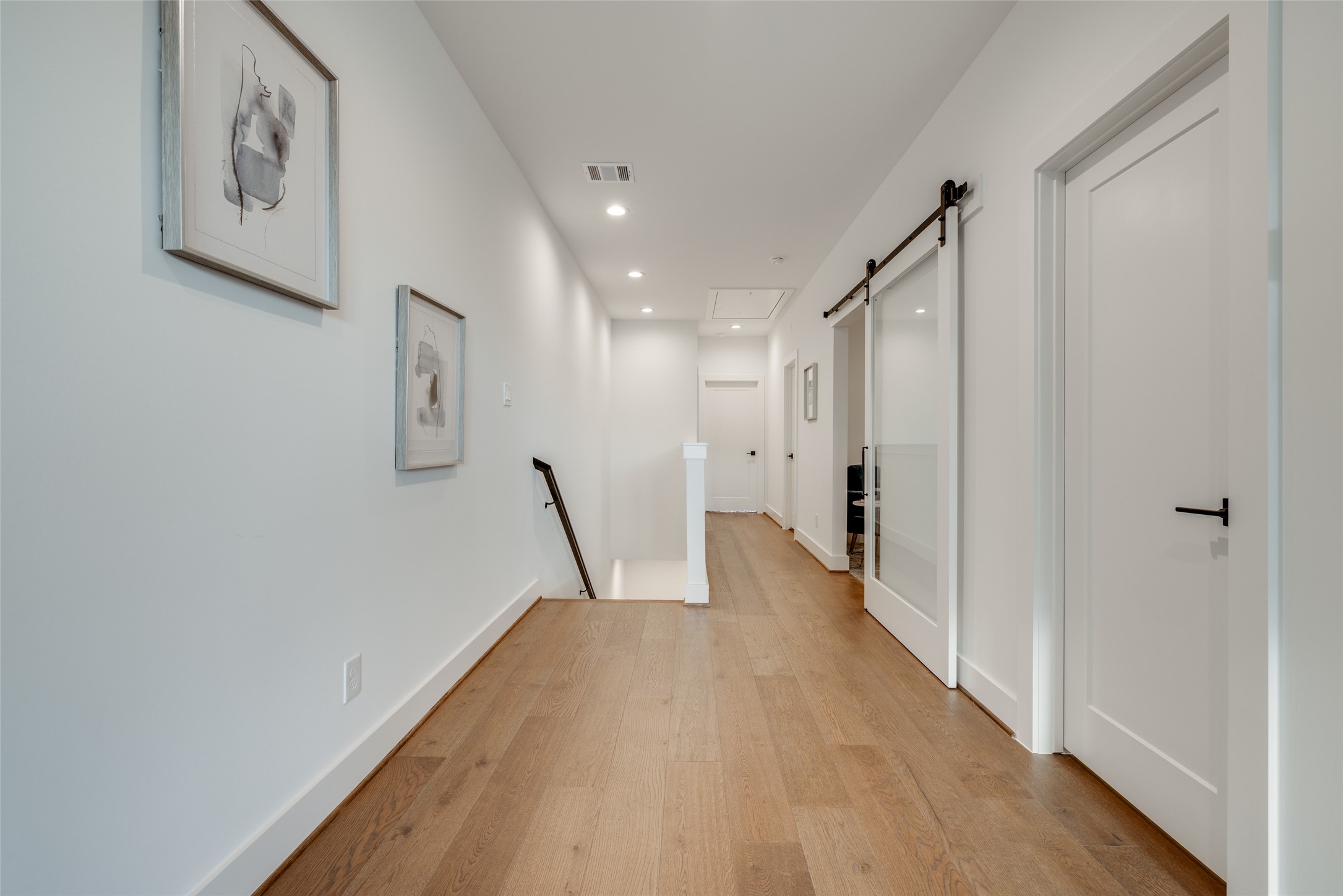 2325 Richton Street Houston, TX 77098 - Photo 41 of 47 a view of a hallway with wooden floor