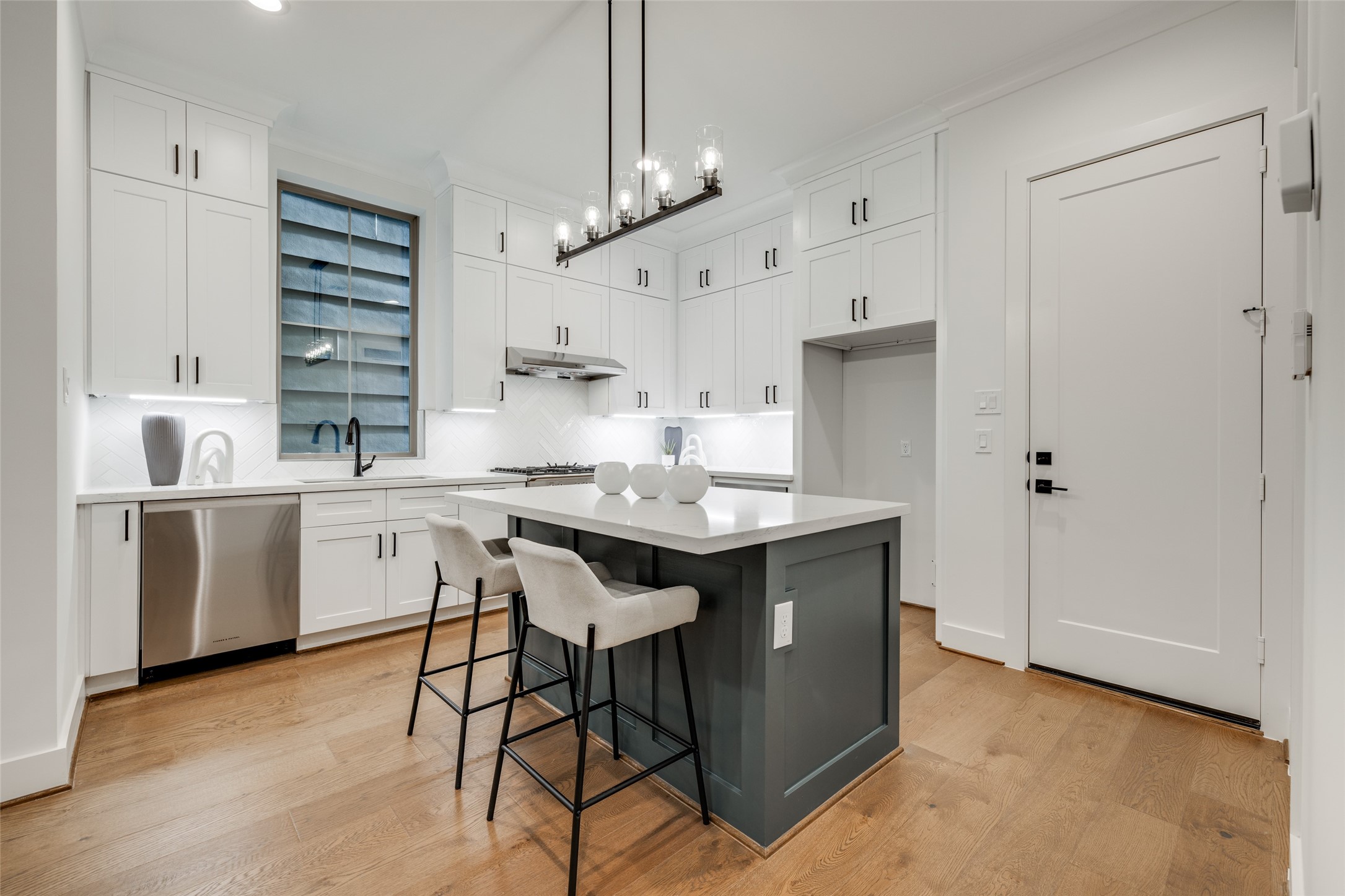 2325 Richton Street Houston, TX 77098 - Photo 9 of 47 a kitchen with kitchen island a sink stainless steel appliances and cabinets