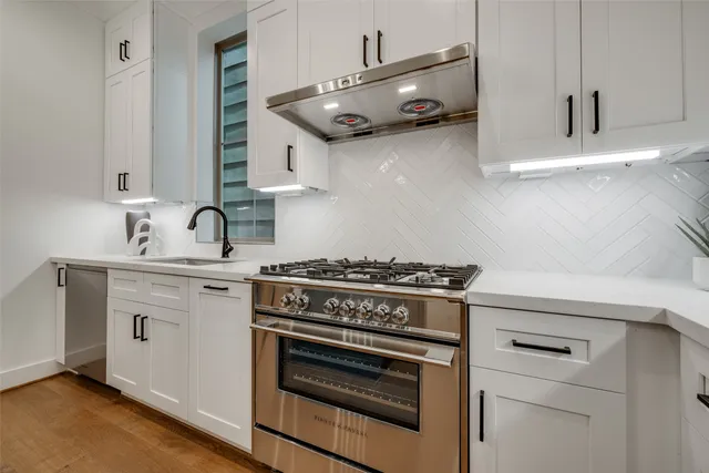 a view of a a dining room and hall with wooden floor