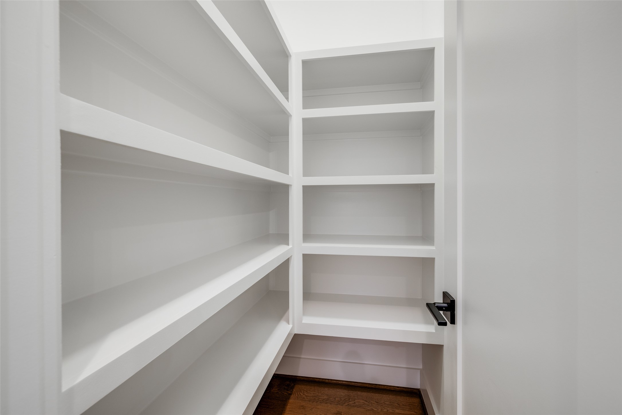 2325 Richton Street Houston, TX 77098 - Photo 15 of 47 a storage room with empty racks