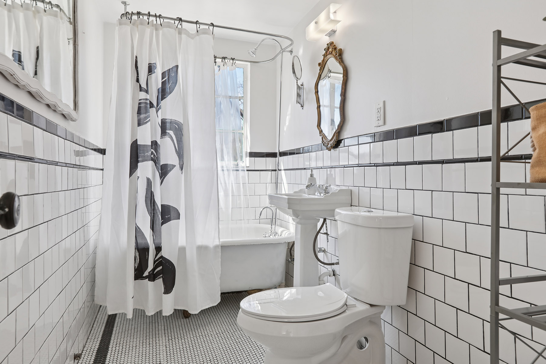 5603 Harold Court Austin, TX 78721 - Photo 12 of 31 a white toilet sitting next to a bathroom sink