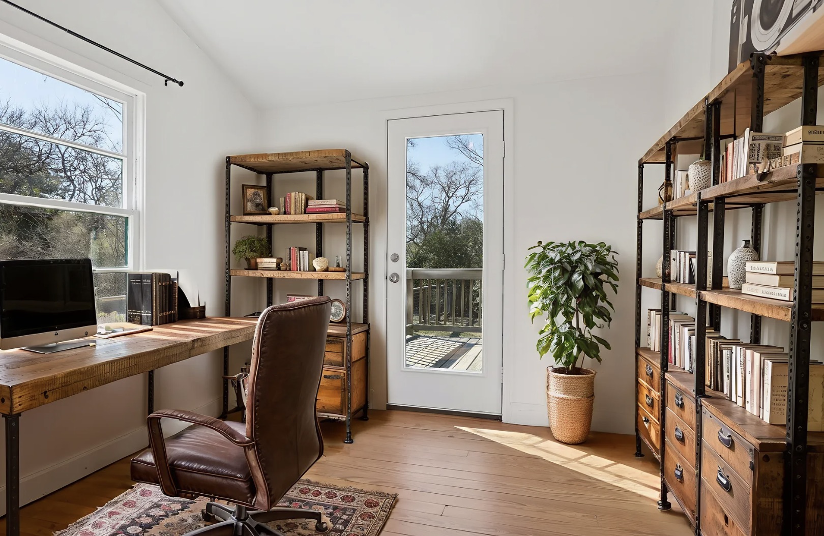 5603 Harold Court Austin, TX 78721 - Photo 14 of 31 a view of a workspace with furniture and a bookshelf