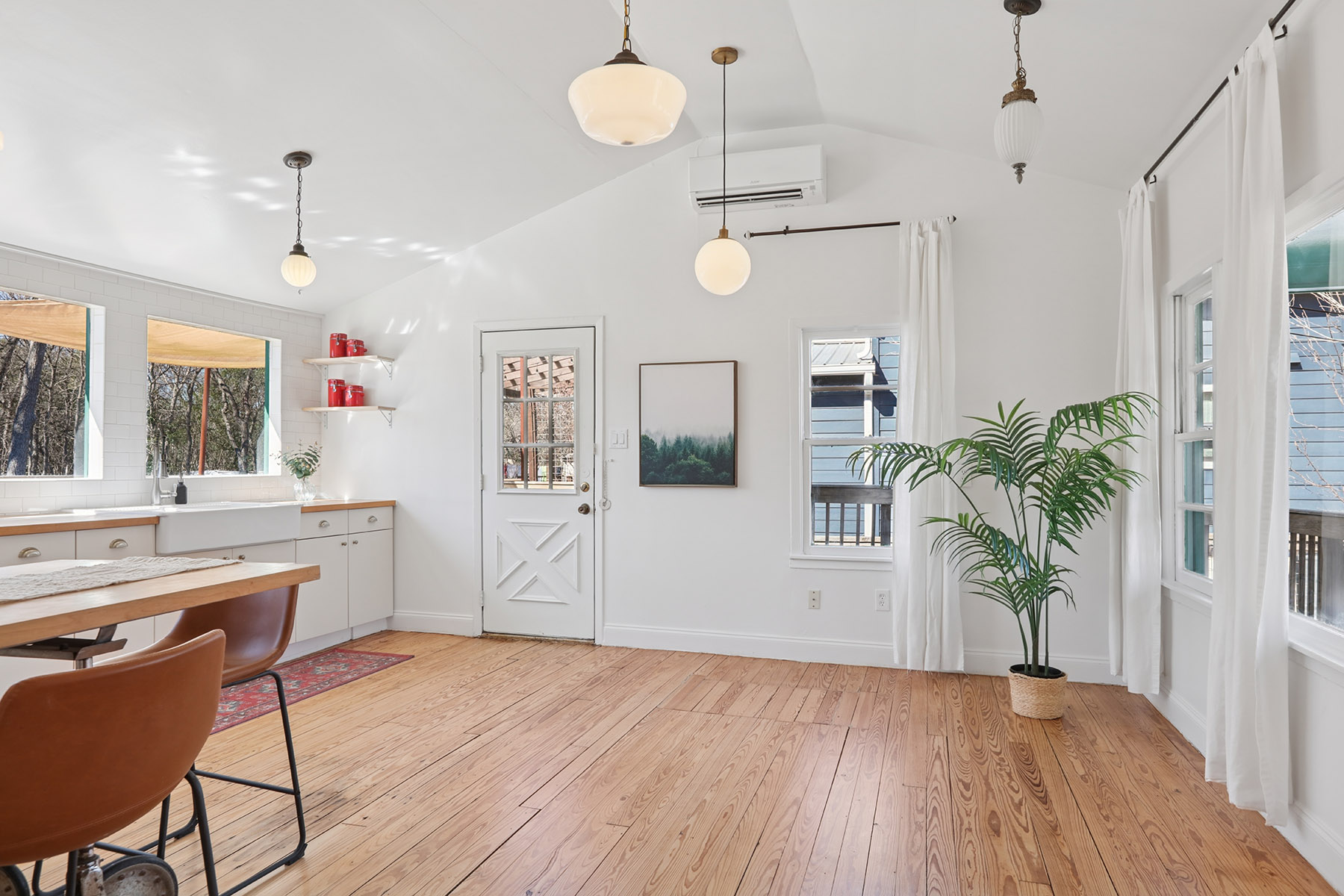 5603 Harold Court Austin, TX 78721 - Photo 30 of 31 a room with kitchen island wooden floor and window