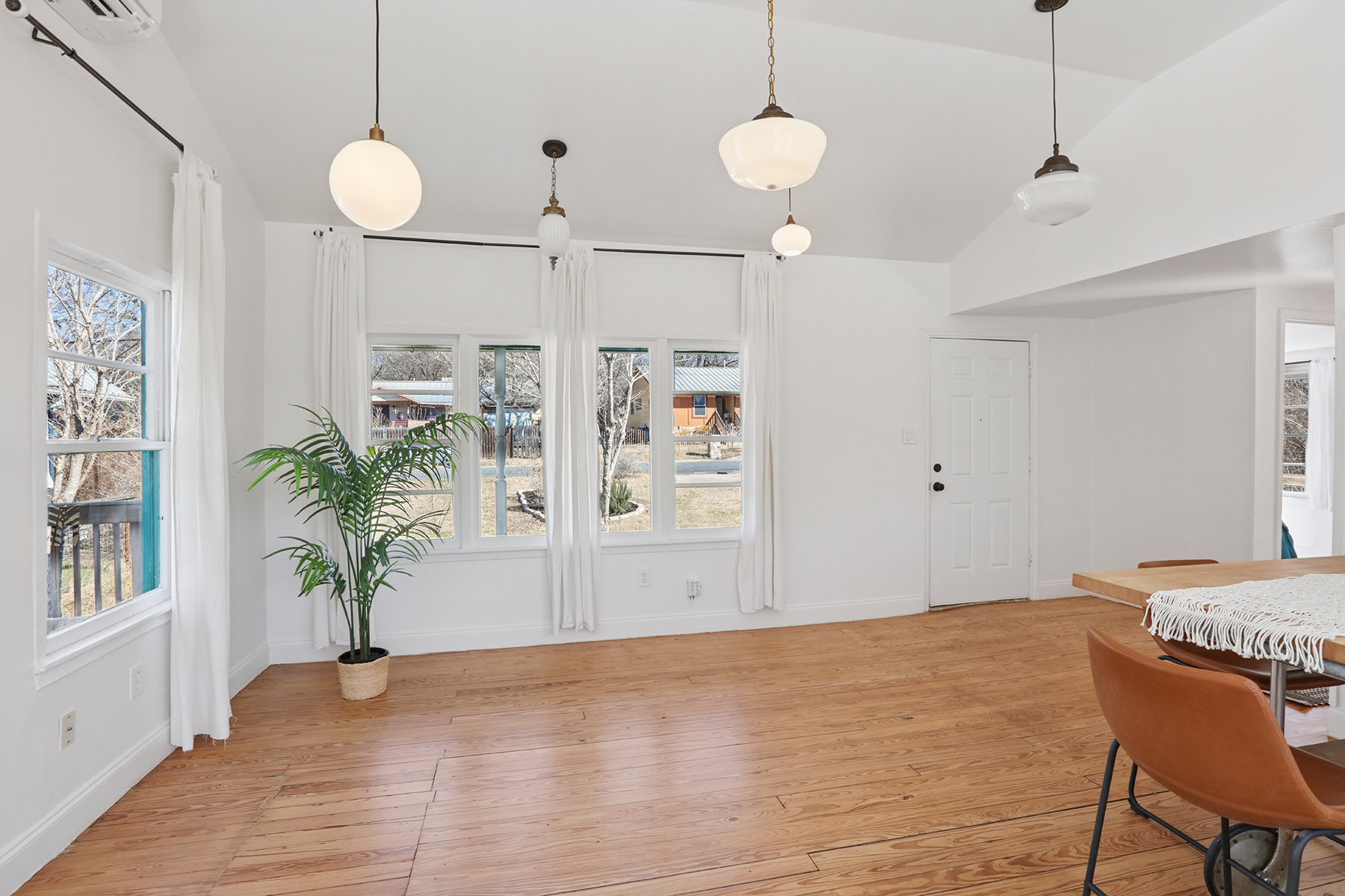 5603 Harold Court Austin, TX 78721 - Photo 8 of 31 a view of a room with wooden floor and furniture