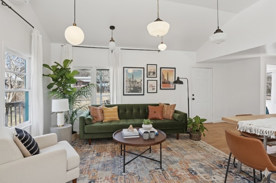 5603 Harold Court Austin, TX 78721 - Photo 9 of 31 a living room with furniture potted plant and a chandelier