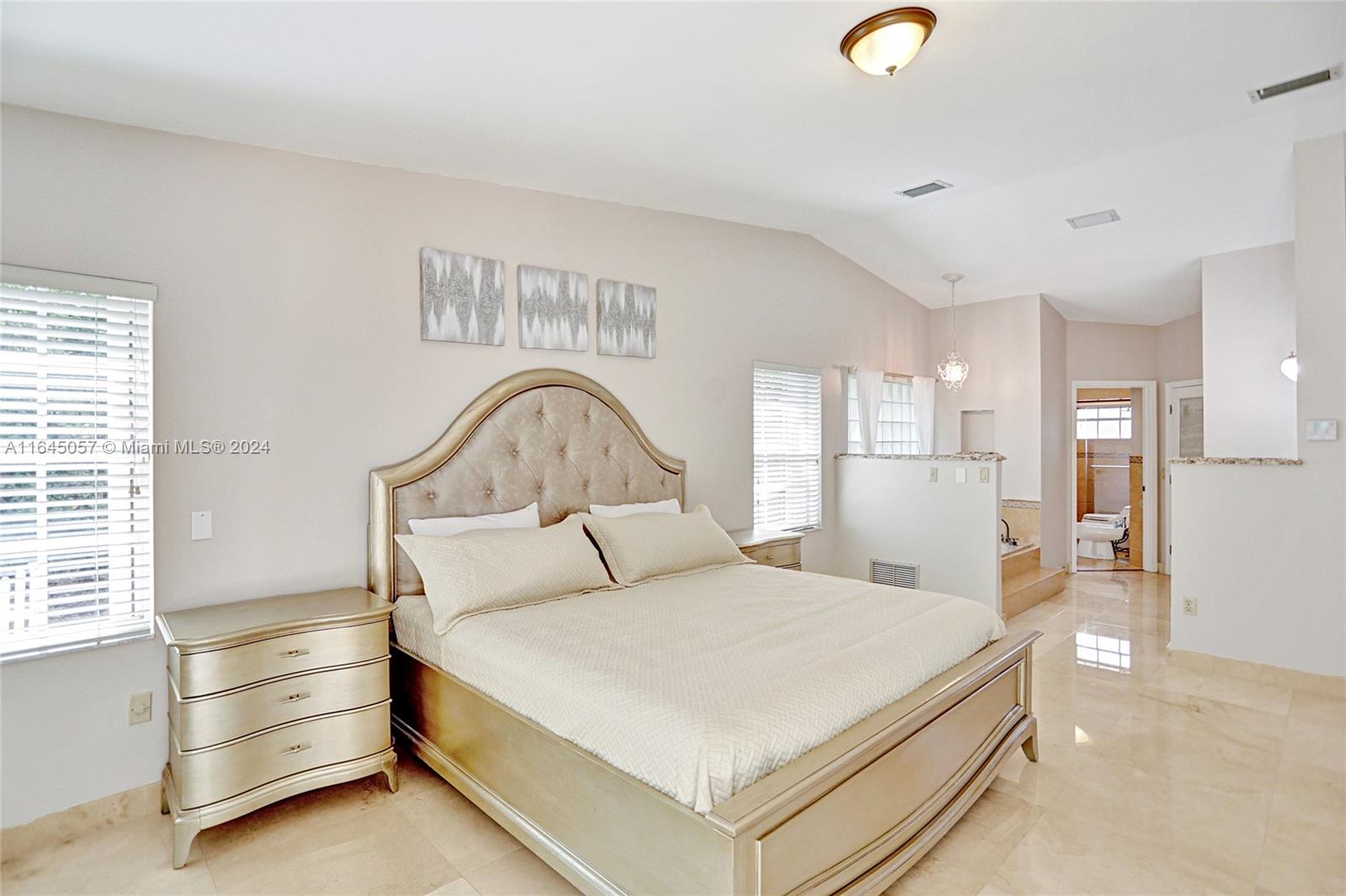 15591 Southwest 42nd Lane Miami, FL 33185 - Photo 16 of 60 a bedroom with a bed and a large window