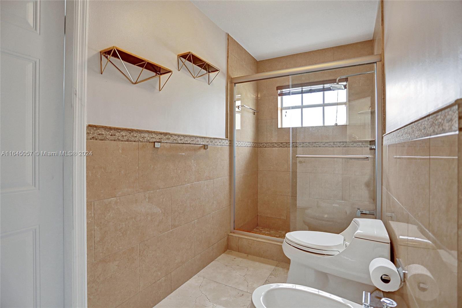 15591 Southwest 42nd Lane Miami, FL 33185 - Photo 20 of 60 a bathroom with a shower a toilet and a shower