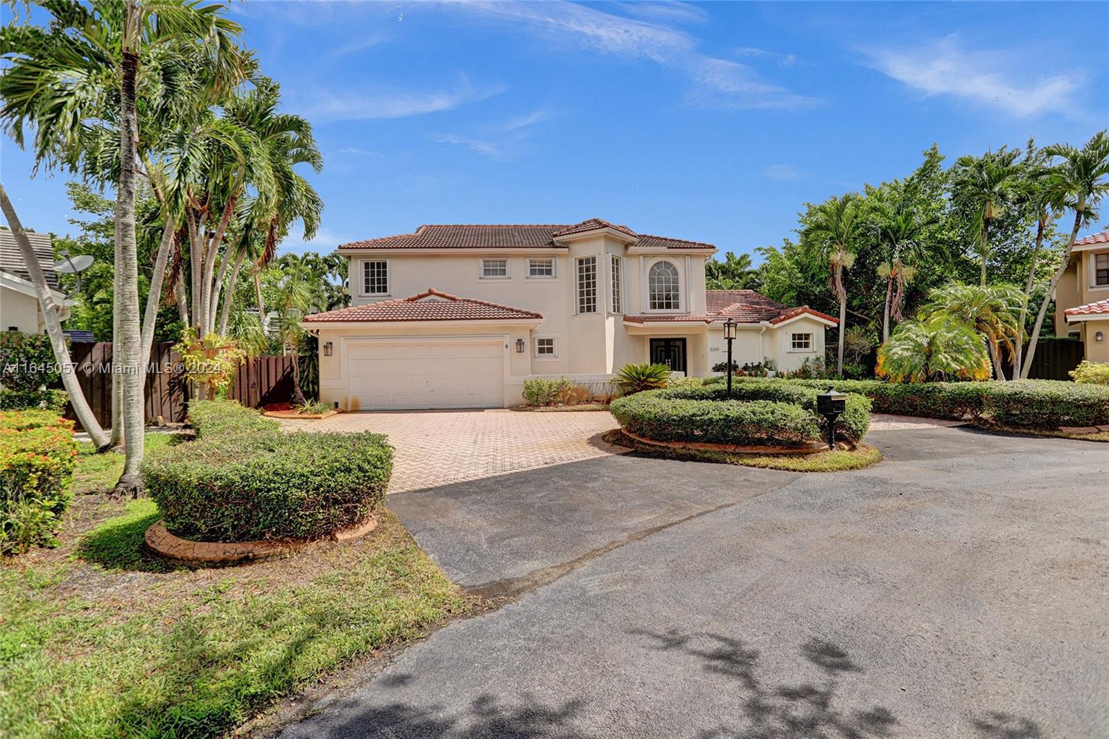 15591 Southwest 42nd Lane Miami, FL 33185 - Photo 2 of 60 a view of a car park in front of a house
