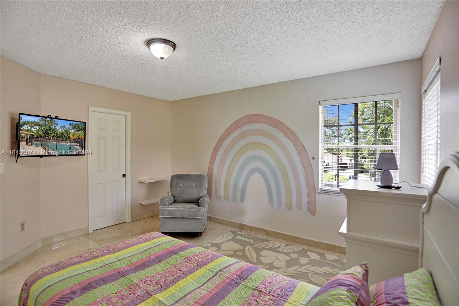 15591 Southwest 42nd Lane Miami, FL 33185 - Photo 29 of 60 a bedroom with a bed and a large window