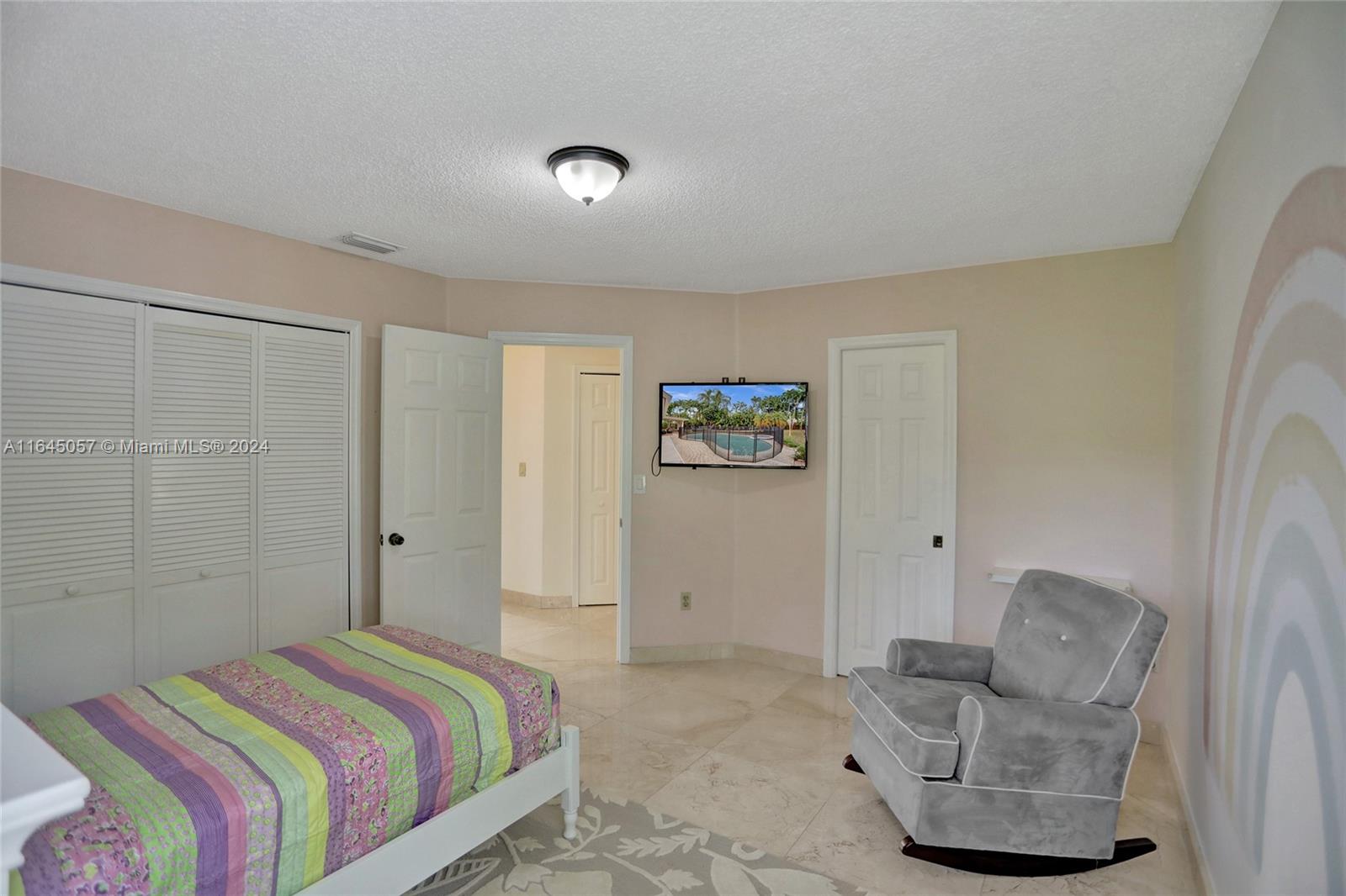 15591 Southwest 42nd Lane Miami, FL 33185 - Photo 30 of 60 a bedroom with a bed and couch