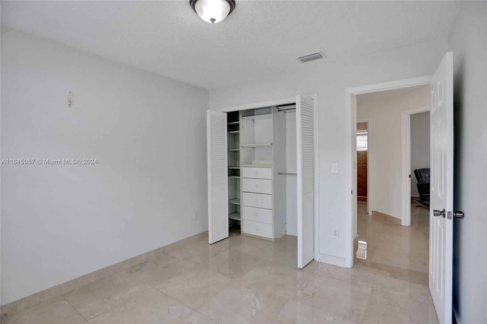 15591 Southwest 42nd Lane Miami, FL 33185 - Photo 37 of 60 an empty room with closet and a bathroom