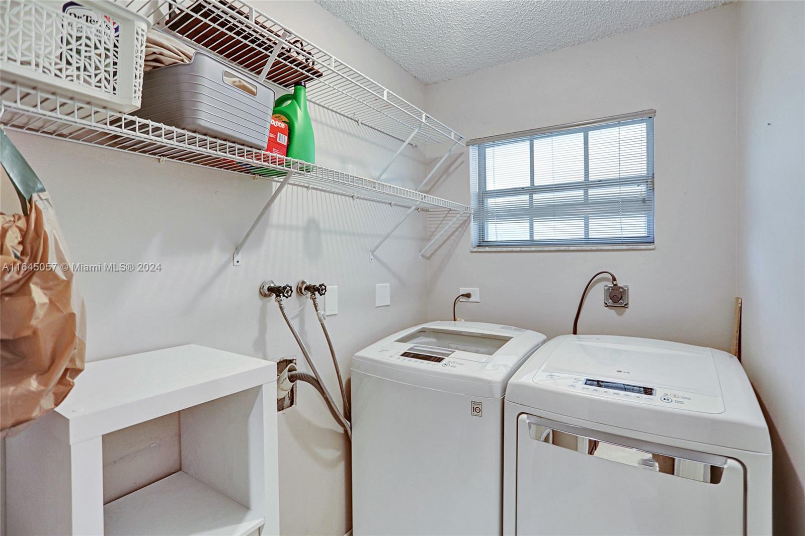 15591 Southwest 42nd Lane Miami, FL 33185 - Photo 40 of 60 a utility room with dryer and washer