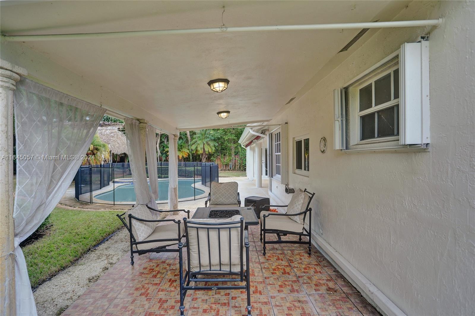 15591 Southwest 42nd Lane Miami, FL 33185 - Photo 44 of 60 a view of a house with backyard and sitting area