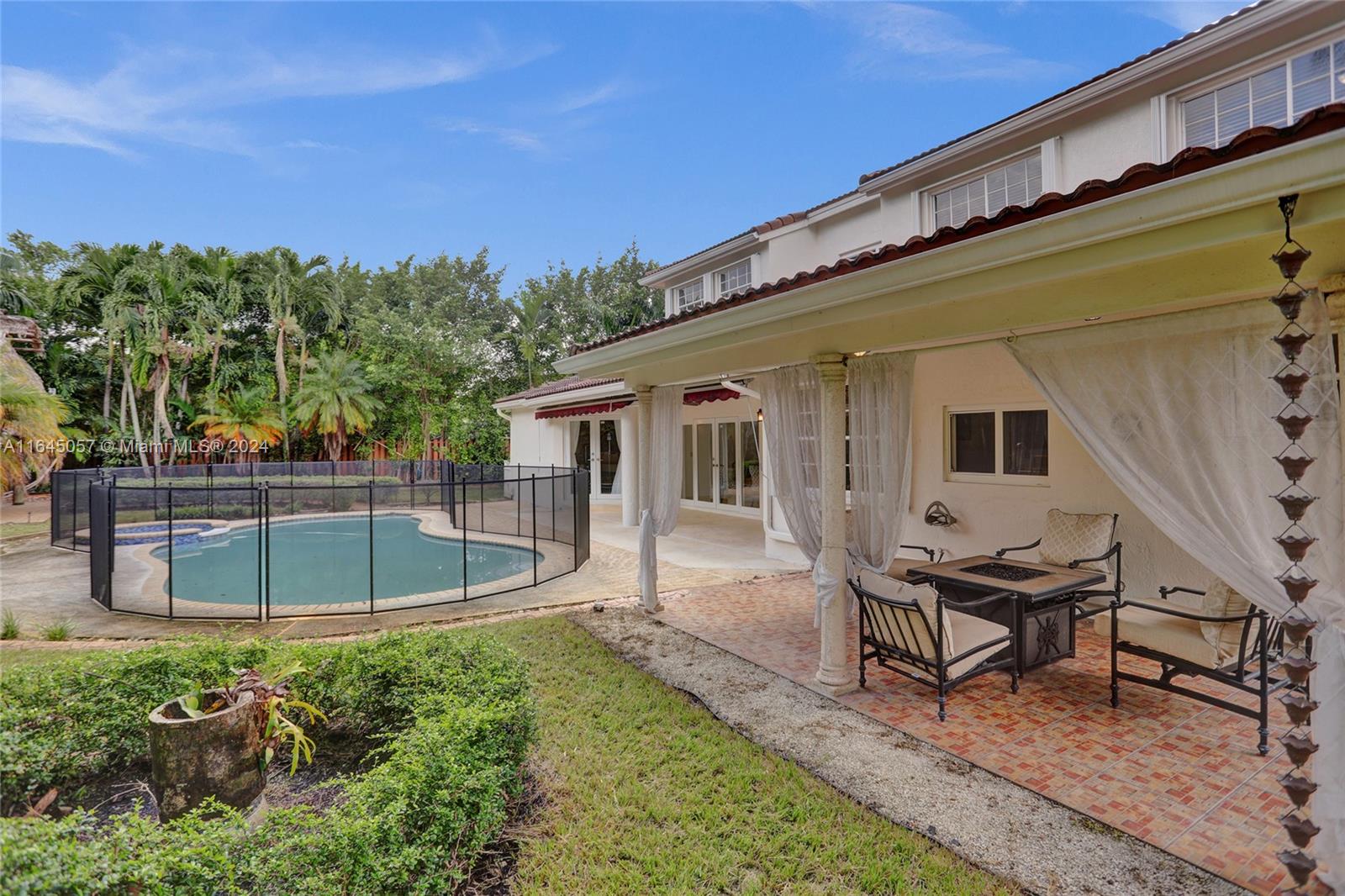 15591 Southwest 42nd Lane Miami, FL 33185 - Photo 45 of 60 a view of a house with backyard and sitting area