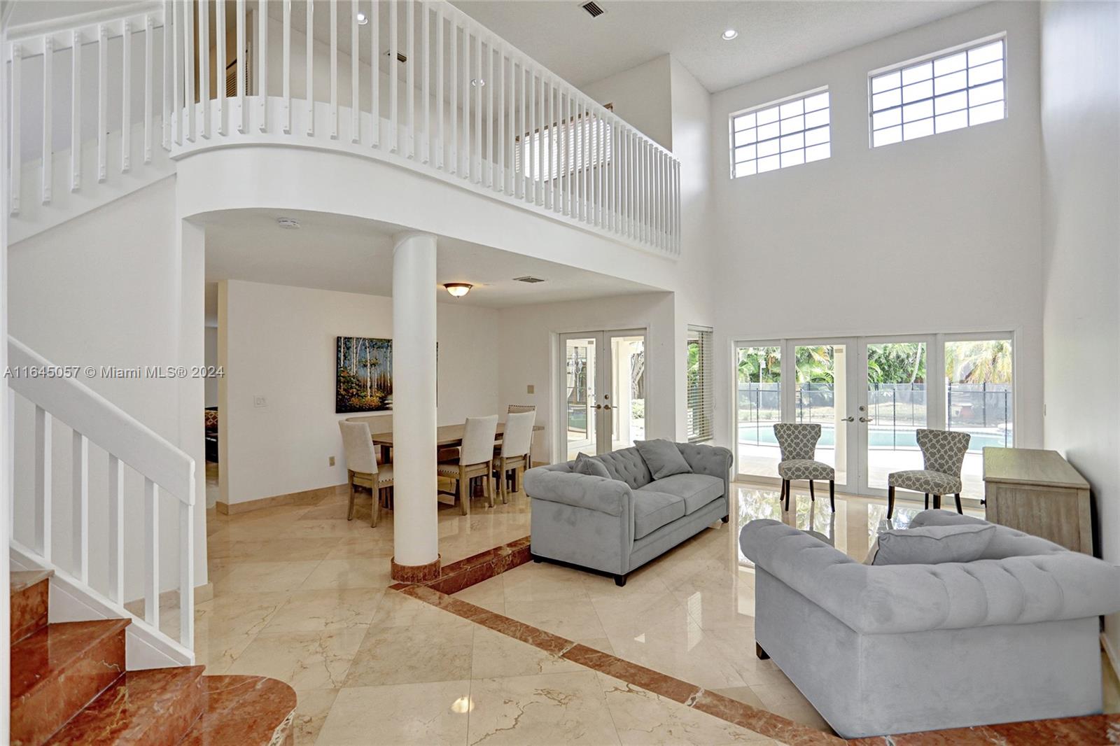 15591 Southwest 42nd Lane Miami, FL 33185 - Photo 5 of 60 a living room with furniture and a large window