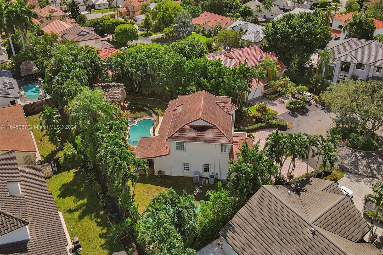15591 Southwest 42nd Lane Miami, FL 33185 - Photo 53 of 60 an aerial view of a house with a yard and garden