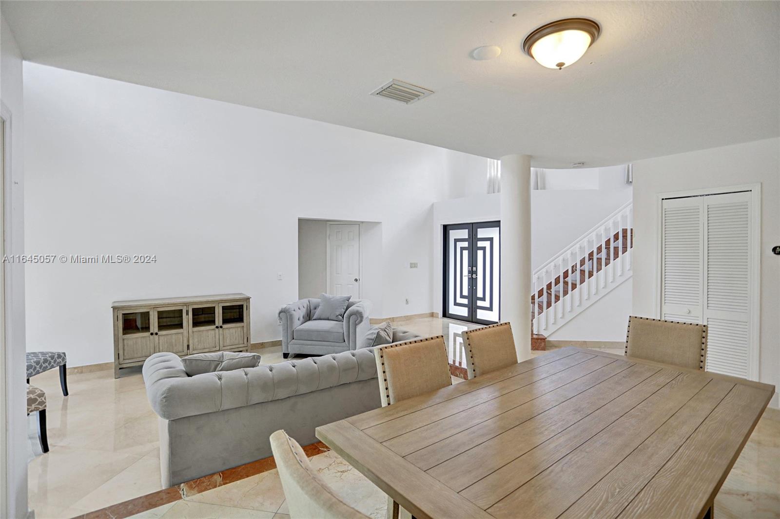 15591 Southwest 42nd Lane Miami, FL 33185 - Photo 8 of 60 a living room with furniture and a wooden floor