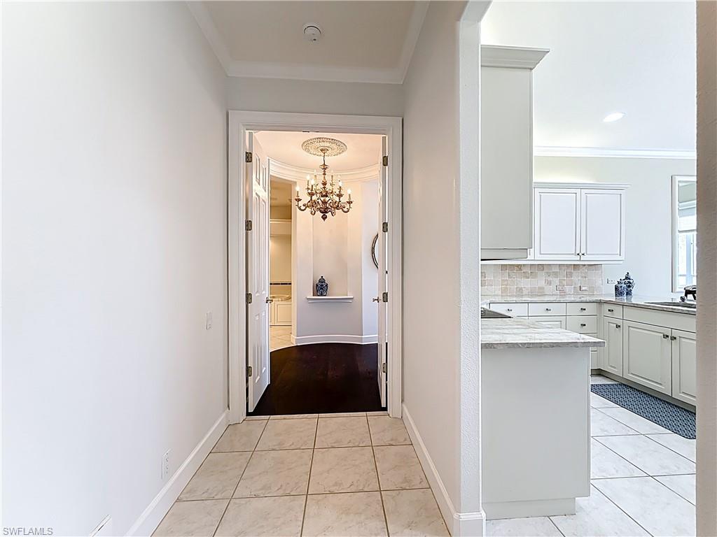 3051 Lancaster Drive, Unit 2 Naples, FL 34105 - Photo 12 of 43 a kitchen with a refrigerator and a sink