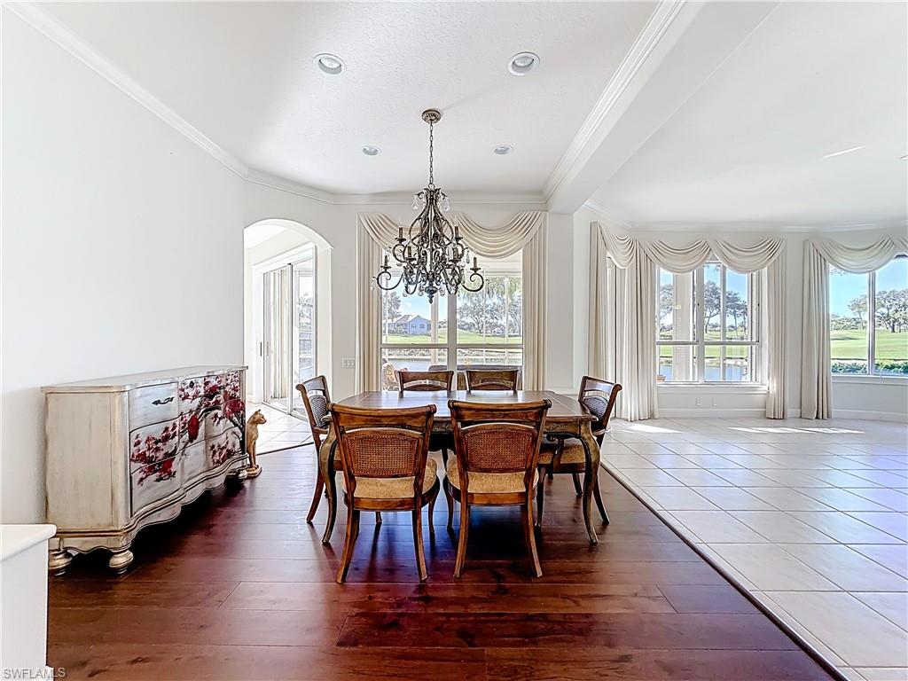 3051 Lancaster Drive, Unit 2 Naples, FL 34105 - Photo 22 of 43 a view of a dining room with furniture window and wooden floor