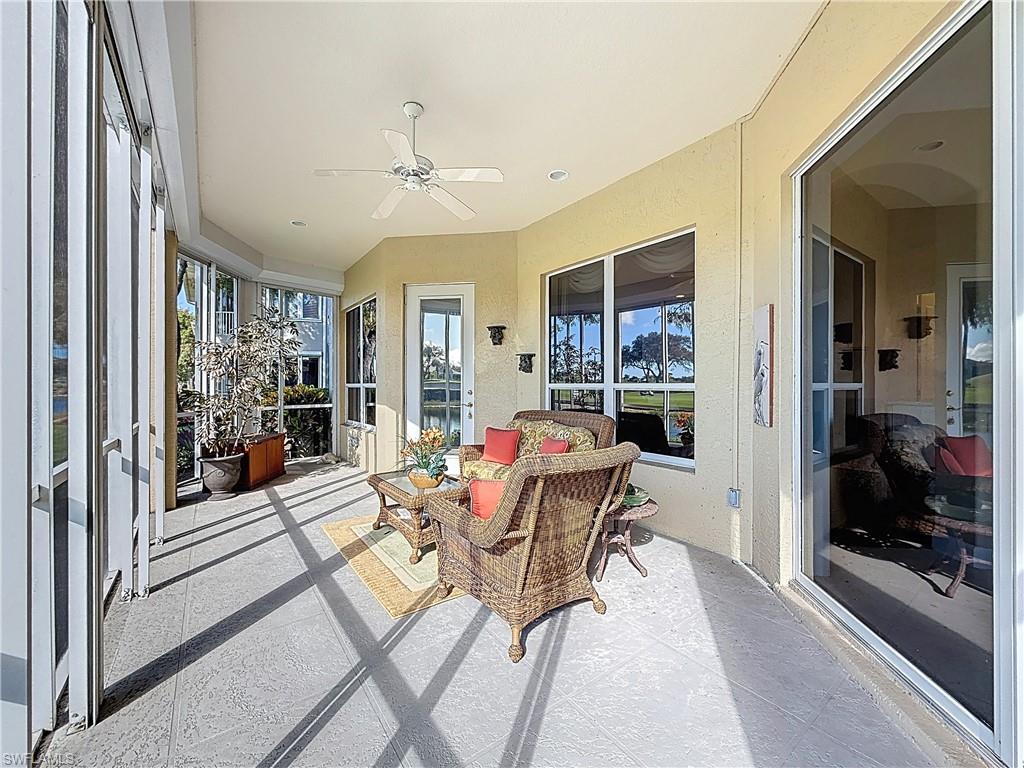 3051 Lancaster Drive, Unit 2 Naples, FL 34105 - Photo 32 of 43 a living room with furniture and a large window