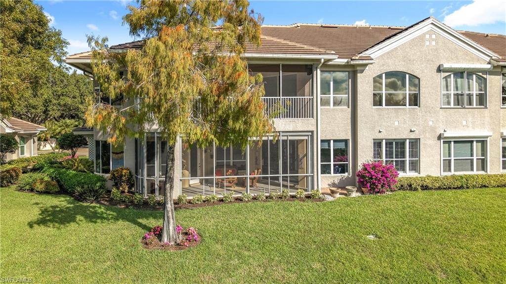 3051 Lancaster Drive, Unit 2 Naples, FL 34105 - Photo 36 of 43 a front view of house with yard