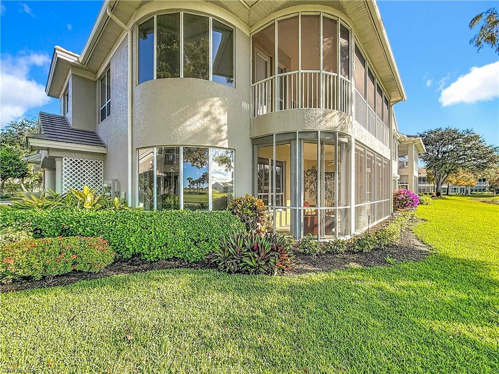 3051 Lancaster Drive, Unit 2 Naples, FL 34105 - Photo 37 of 43 a view of a house with backyard and garden