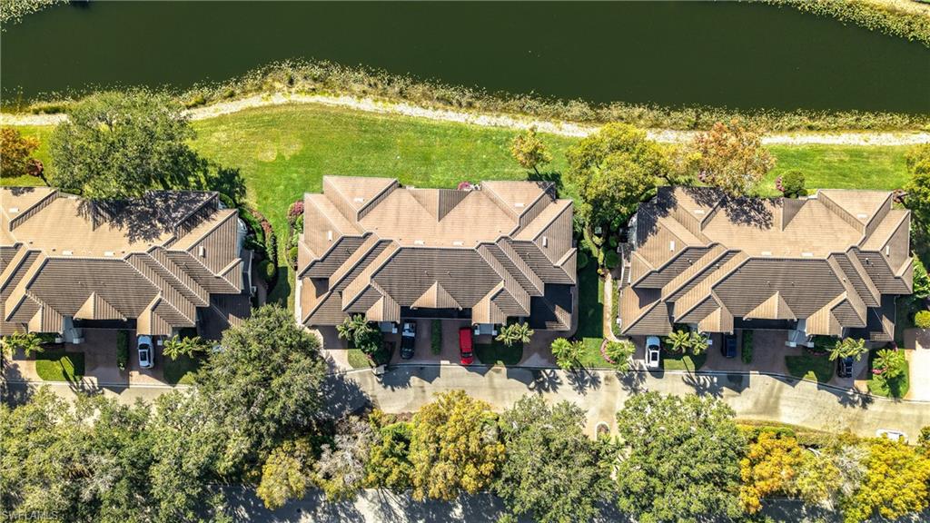 3051 Lancaster Drive, Unit 2 Naples, FL 34105 - Photo 39 of 43 an aerial view of a house with a garden and swimming pool