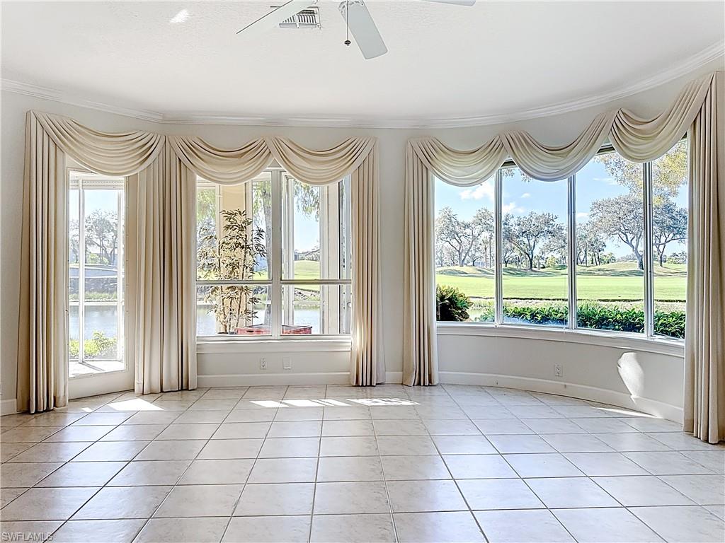 3051 Lancaster Drive, Unit 2 Naples, FL 34105 - Photo 8 of 43 a view of an empty room with a window