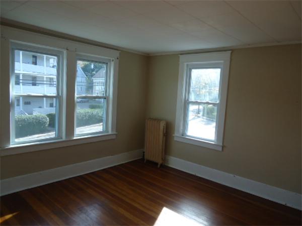 2005-2007 Palmer Road Three Rivers, MA 01080 - Photo 13 of 14 an empty room with wooden floor and windows