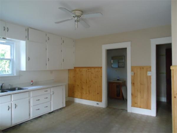 2005-2007 Palmer Road Three Rivers, MA 01080 - Photo 8 of 14 a view of cabinets a sink a window and a refrigerator