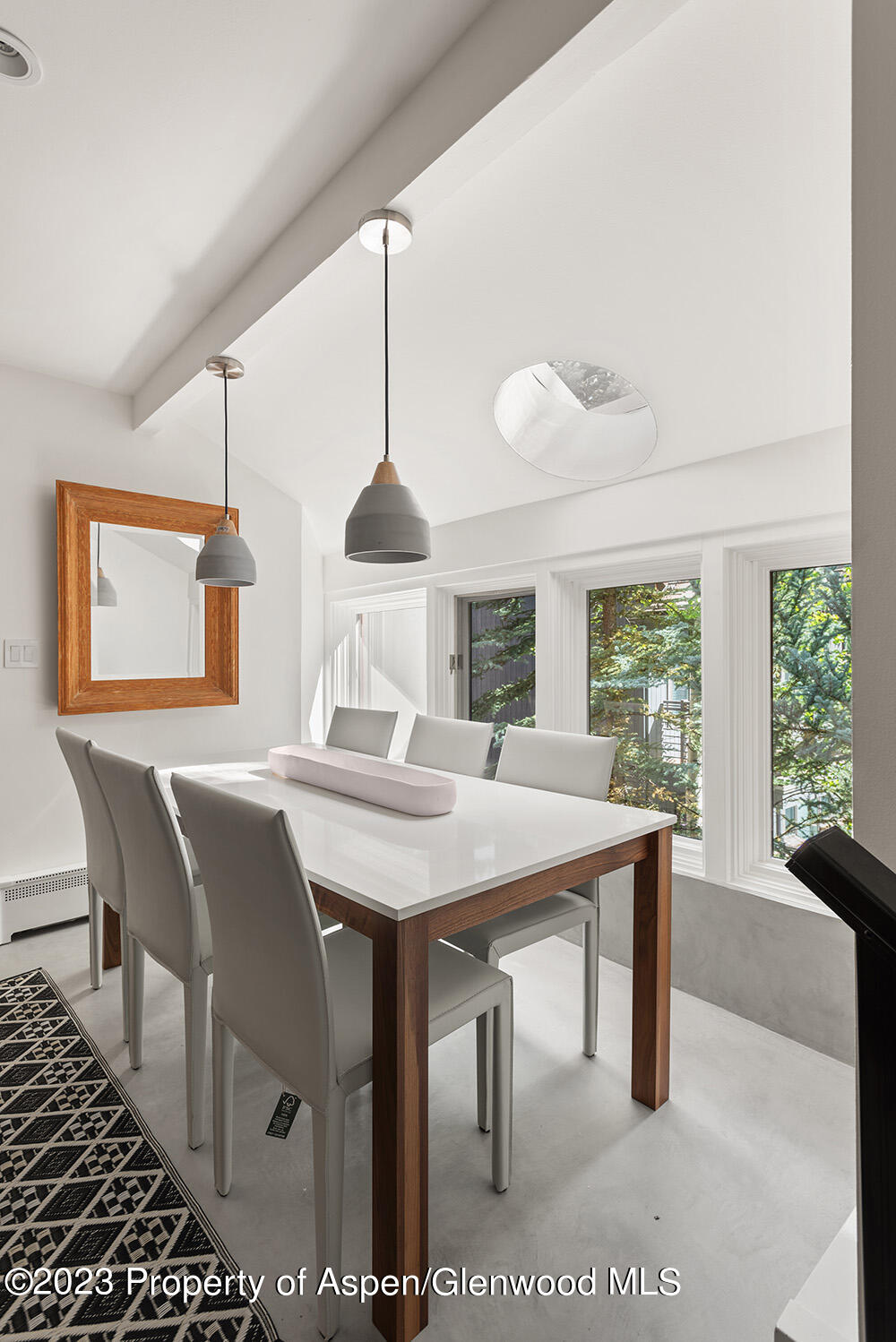 900 East Durant Avenue, Unit 116 Aspen, CO 81611 - Photo 10 of 19 a view of a dining room with furniture window and outside view