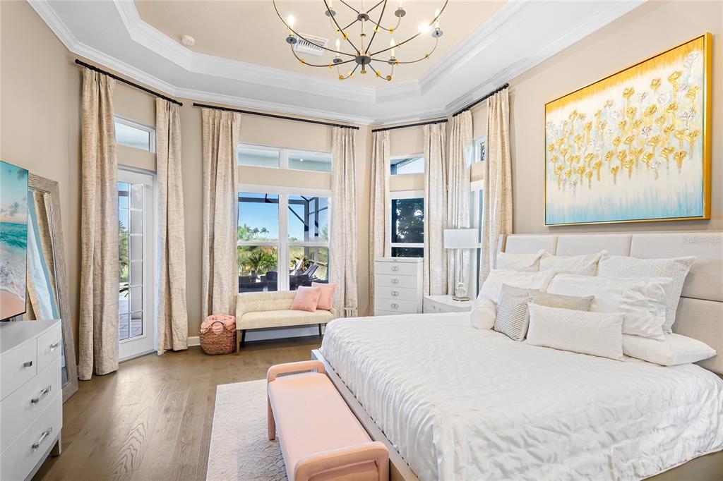 8232 Summer Night Road Sarasota, FL 34241 - Photo 16 of 82 a spacious bedroom with a bed and a large window