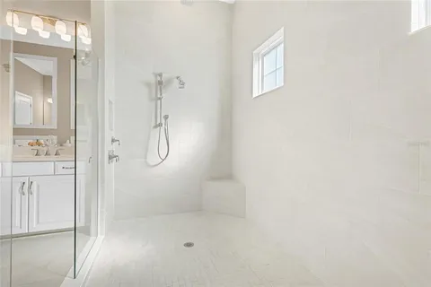 a utility room with cabinets washer and dryer