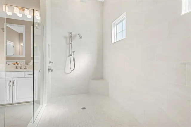 a utility room with cabinets washer and dryer