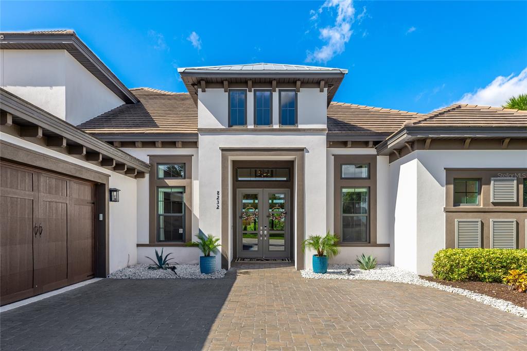 8232 Summer Night Road Sarasota, FL 34241 - Photo 2 of 82 a front view of a house with a yard