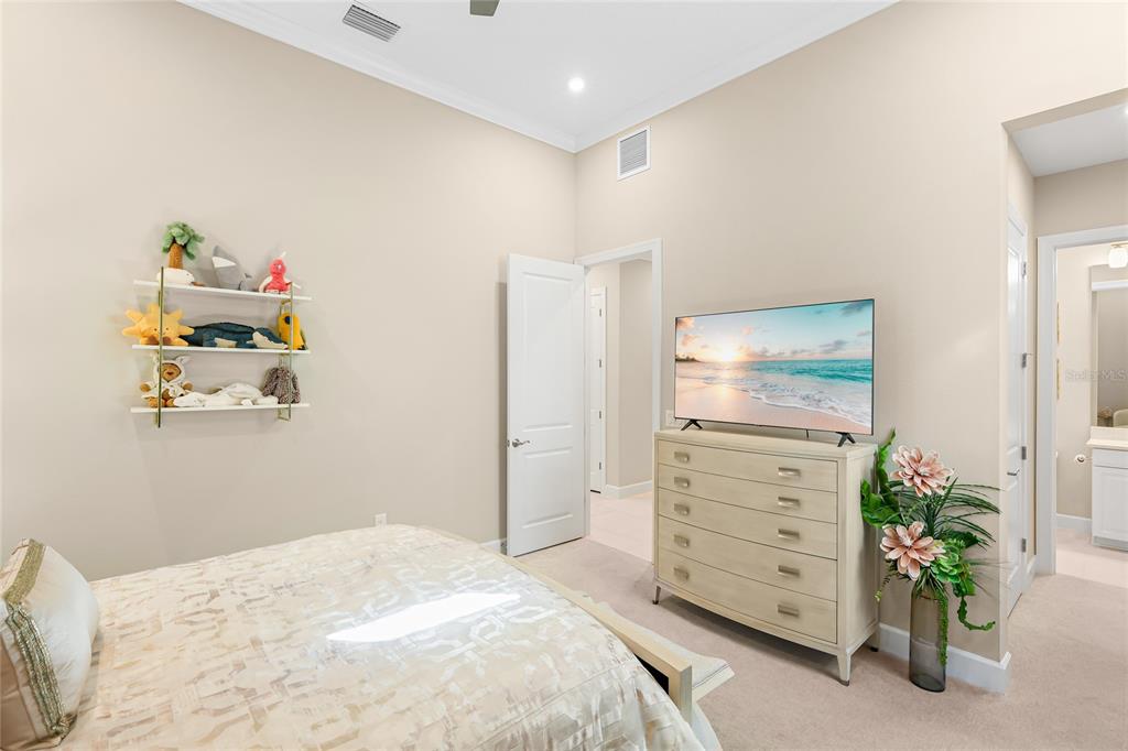 8232 Summer Night Road Sarasota, FL 34241 - Photo 23 of 82 a bedroom with a bed and a dresser